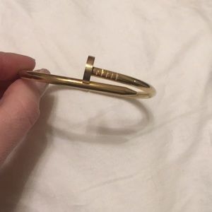 Gold tone metal nail bracelet